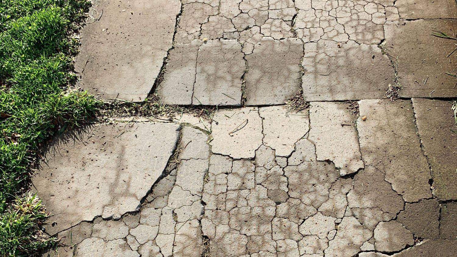 cracked commercial sidewalk panel needing repair